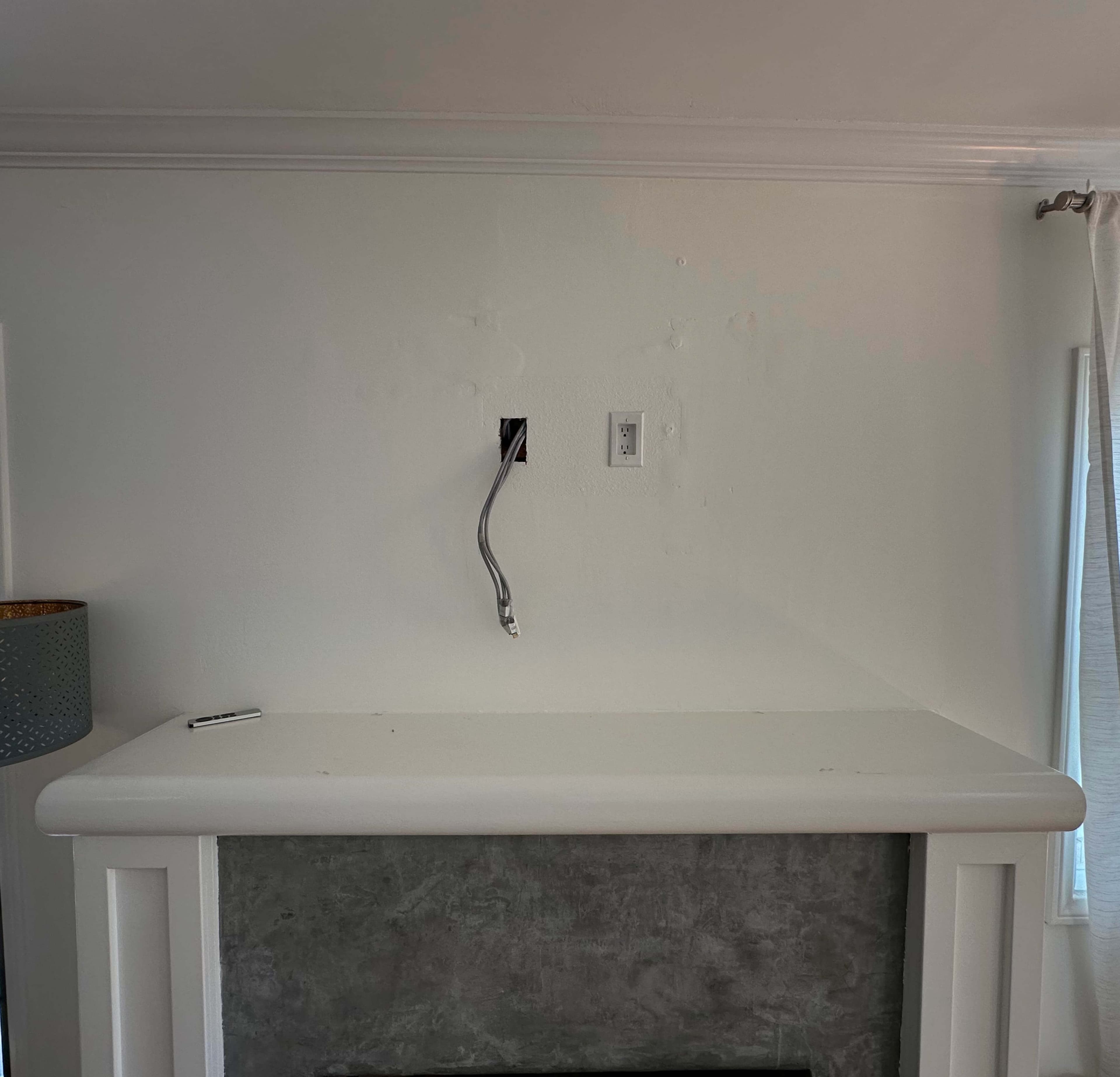 TV mounting before above a fireplace