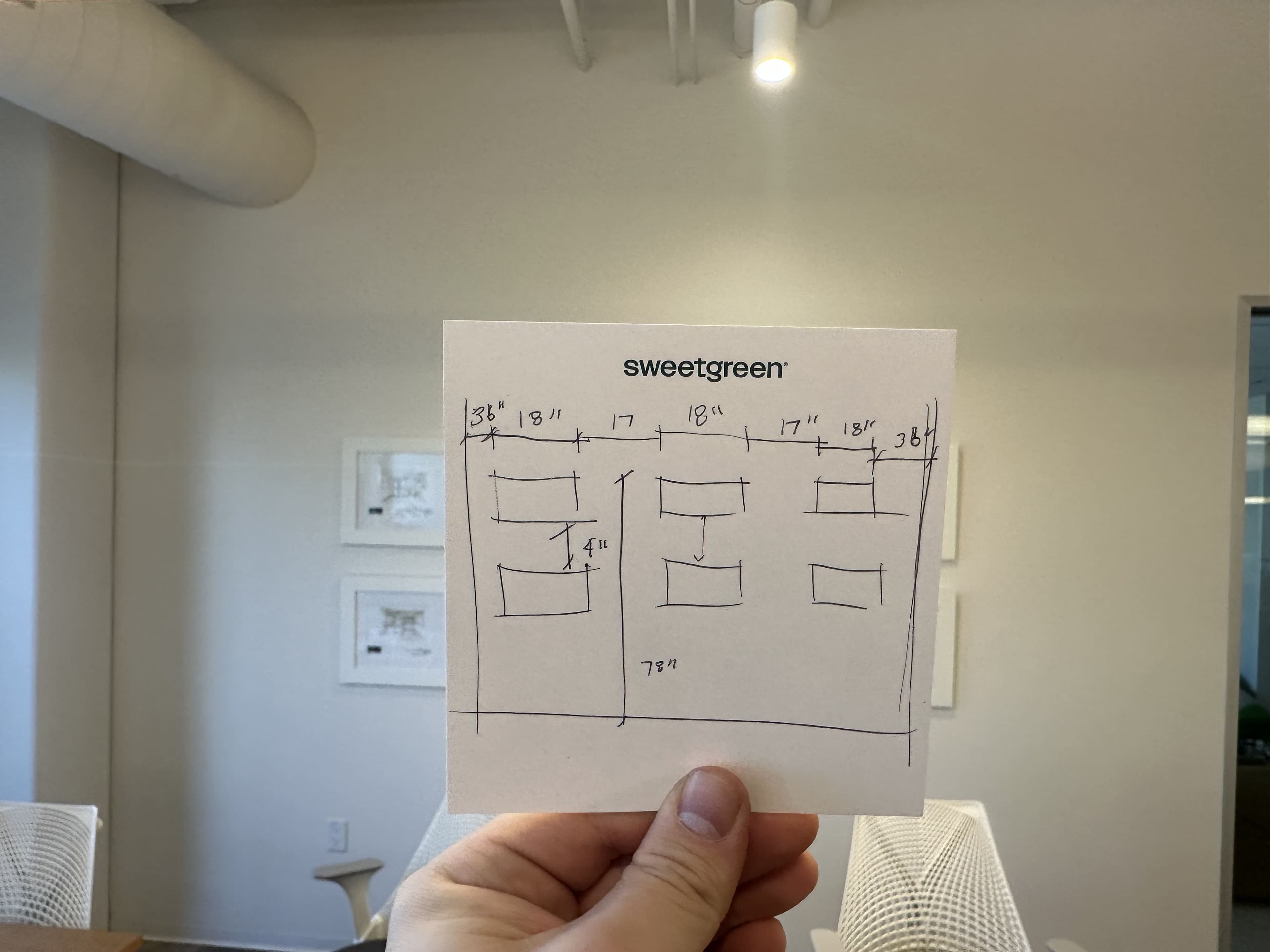 Gallery wall installation plan with paper templates before frames are hung