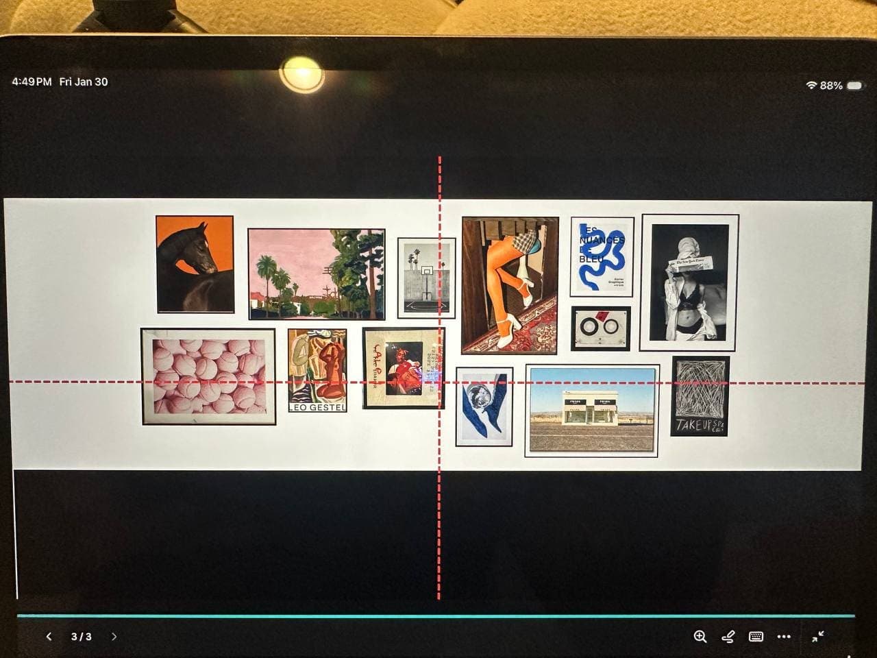 Gallery wall installation plan with paper templates before frames are hung