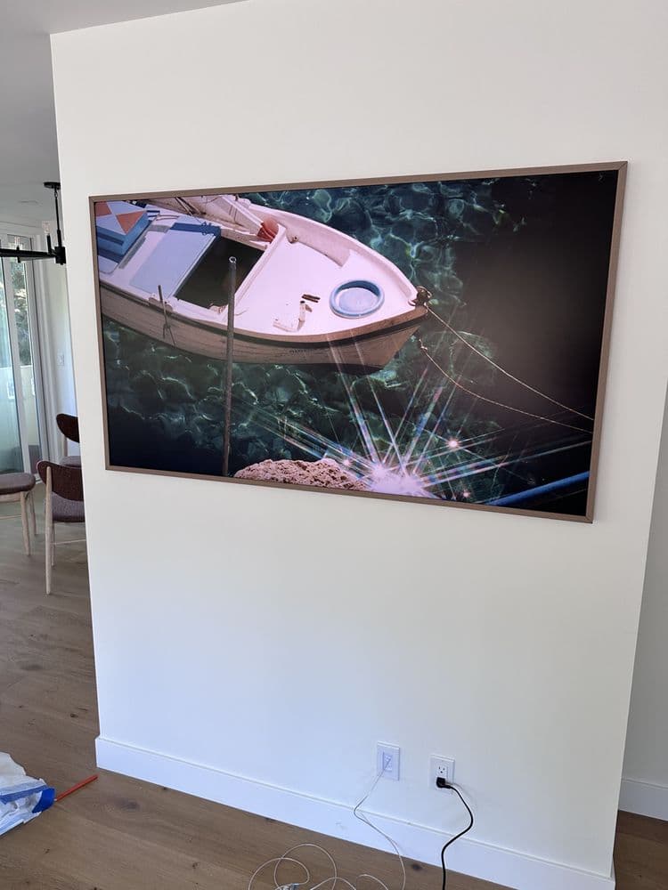 Large TV leveled and mounted on the wall