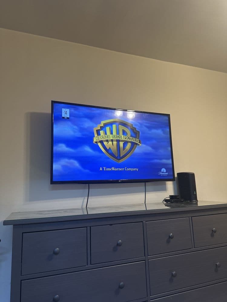 Slim TV installation in a bright room