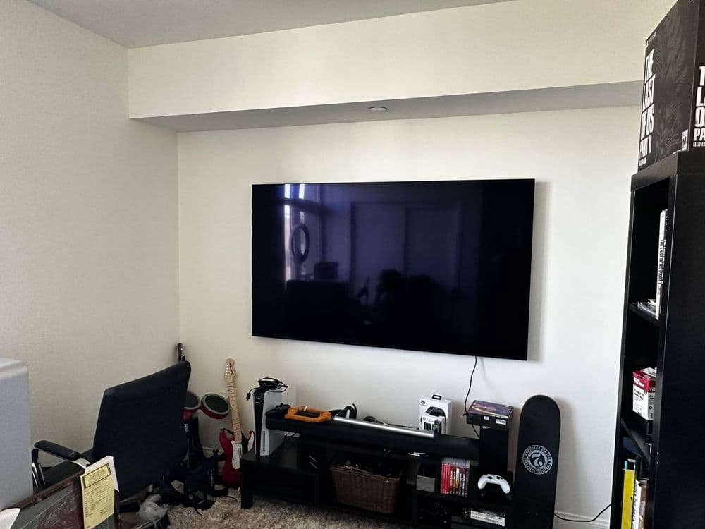 Wall-mounted TV with tidy cable management