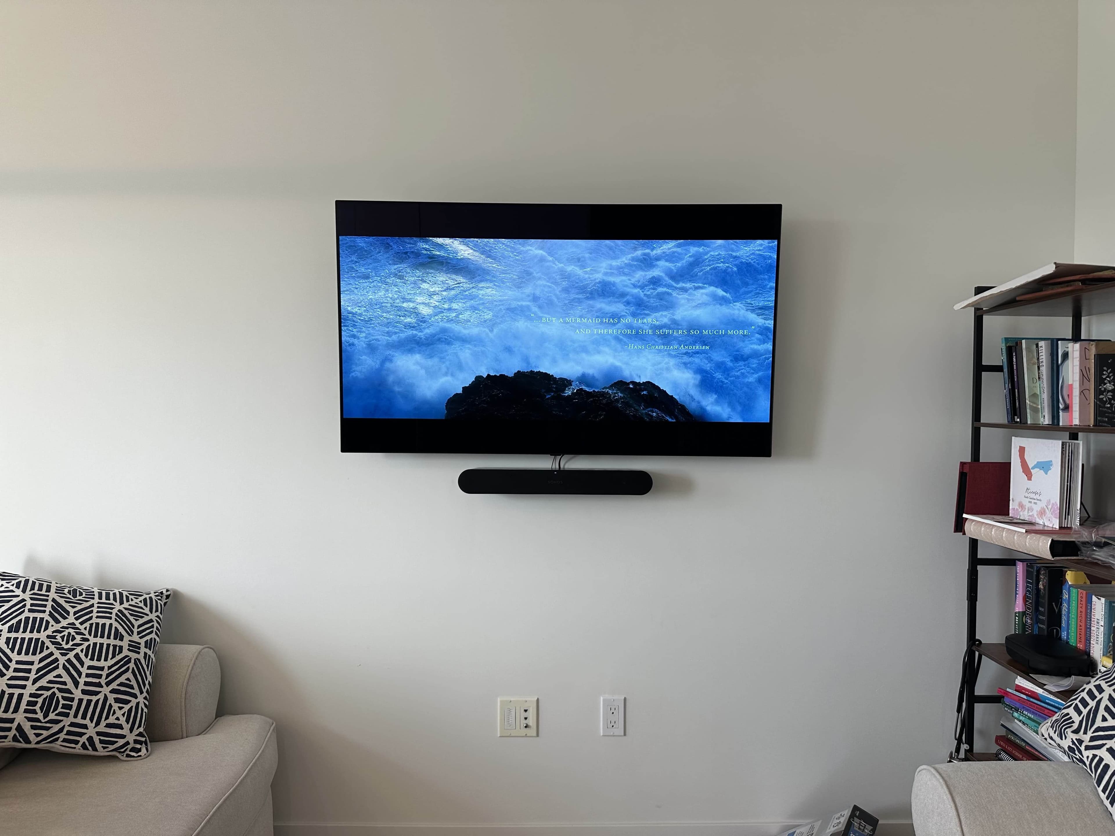 Wall-mounted TV with a clean entertainment setup