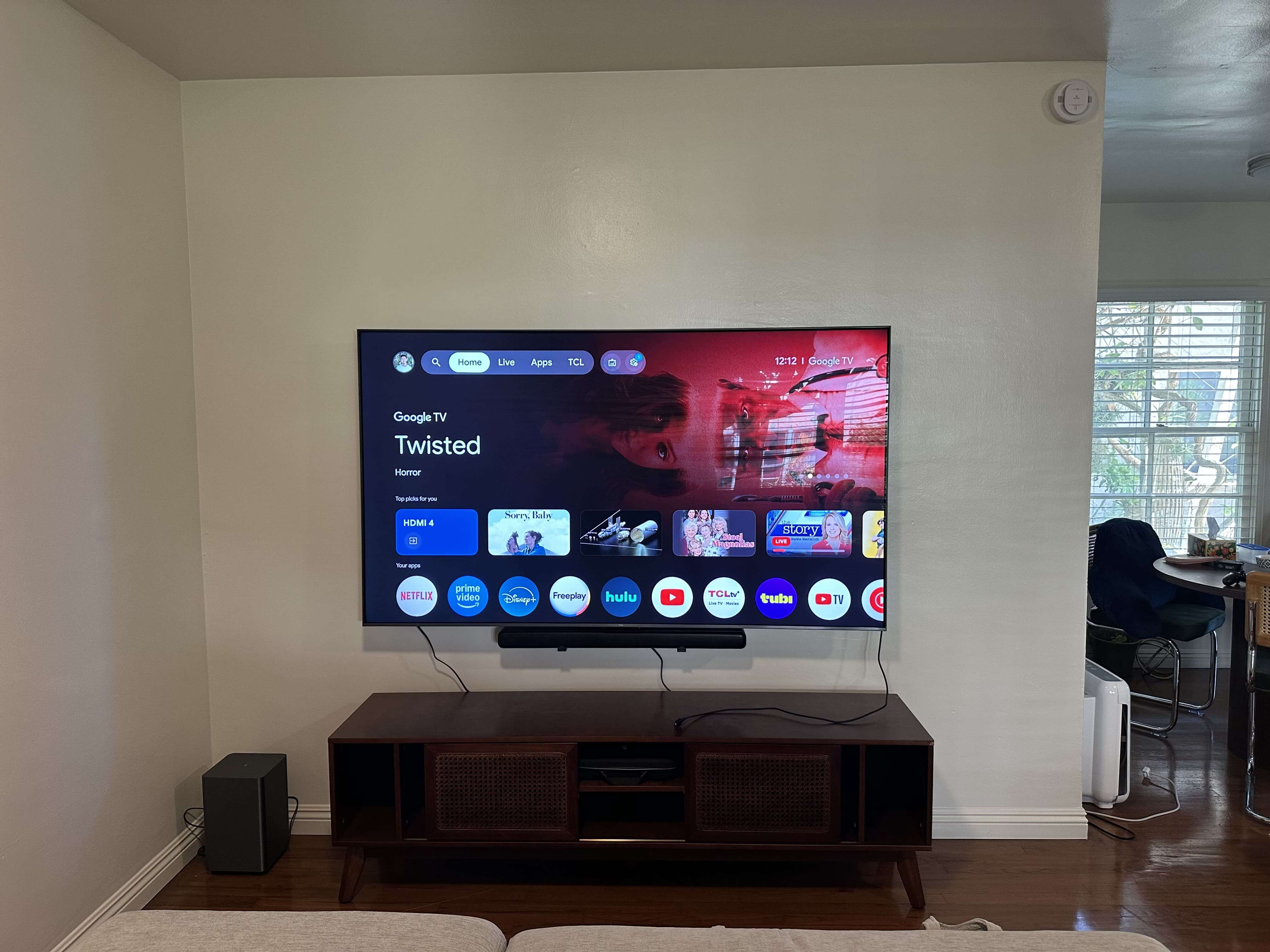 Wall-mounted TV with a clean entertainment setup
