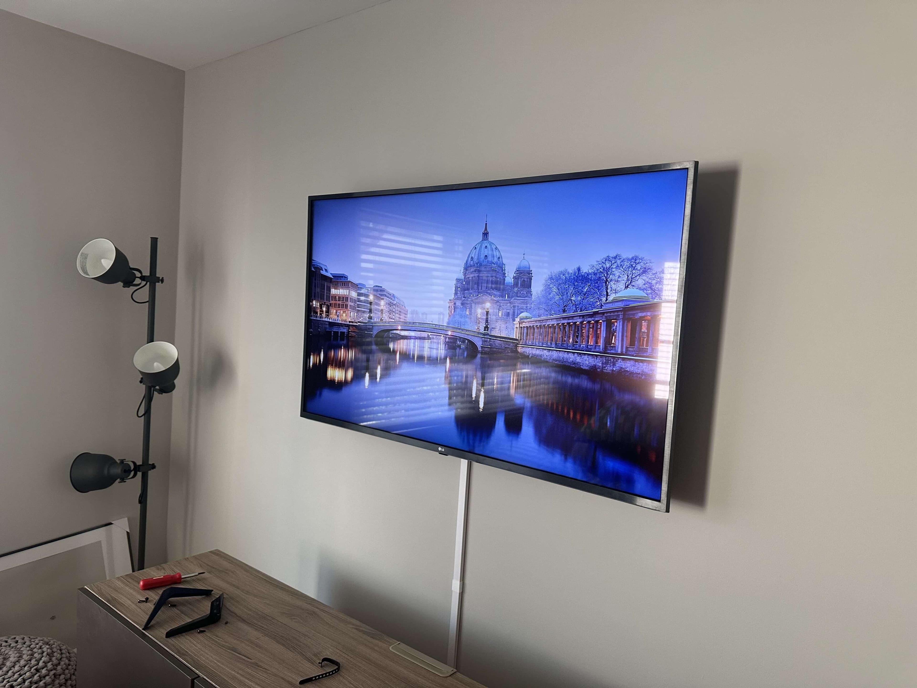 Wall-mounted TV with a clean entertainment setup